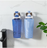 Hanging ergonomic wall holder for a bottle of shampoo, sanitizer