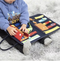 Childrens interactive sensory toy for the development of fine motor skills and thinking, a busy board in the form of a pencil case