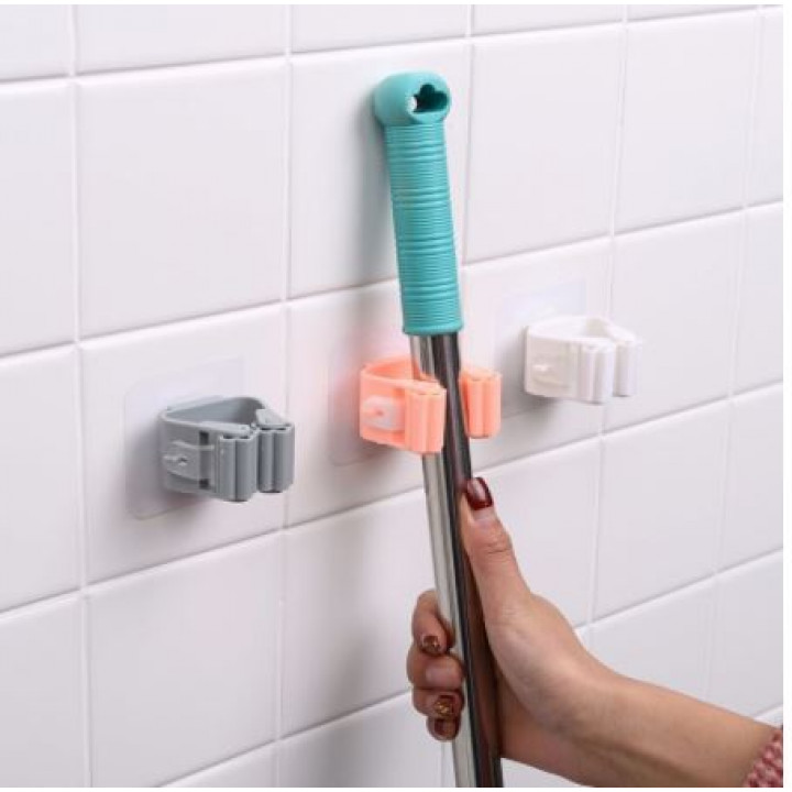 Wall-mounted mop holder with roller mechanism 