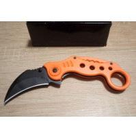 Classic orange dangerous knife karambit, a gift to a fisherman, a hunter, a man