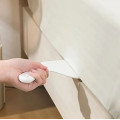 A convenient tuck spoolie for tight spaces, a tool for quickly and easily tucking sheets and bedding onto a bed, mattress, or sofa
