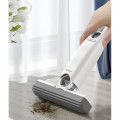 Compact, self-wringing mini brush for quick cleaning of surfaces, floors, windowsills, countertops